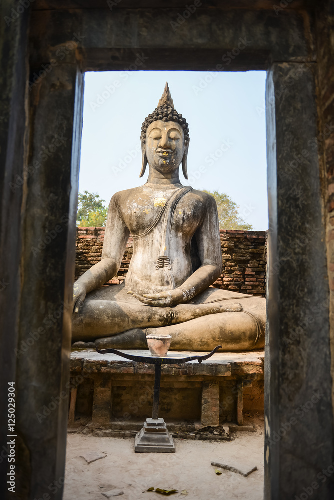 Old buddha in the temple at Sukhothai Historical Park in Sukhothai Province, Thailand