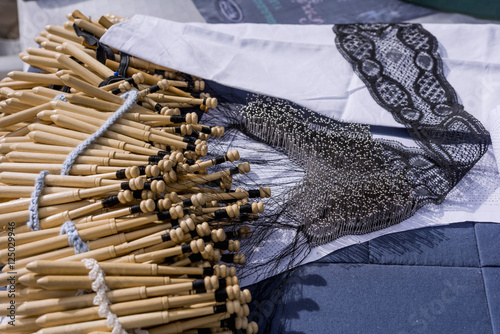 Close-up of artisanal manufacturing tatting. Bobbin lace manufacturing photo