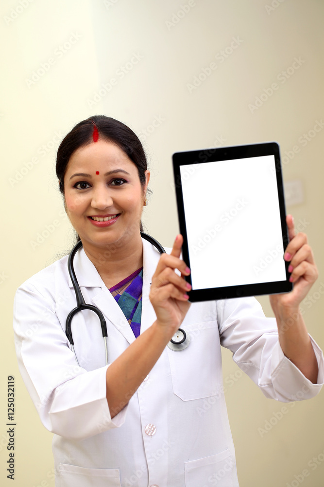 Young female doctor showing blank white screen tablet computer Young female doctor showing blank white screen tablet computer
