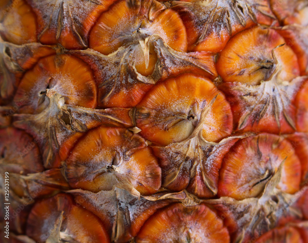 Macro photo of orange exotic fruit pineapple with textured skin. Macro photo of orange exotic fruit pineapple with textured skin.