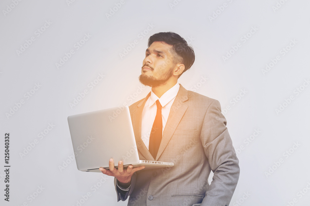 business man with laptop on gray background business man with laptop on gray background
