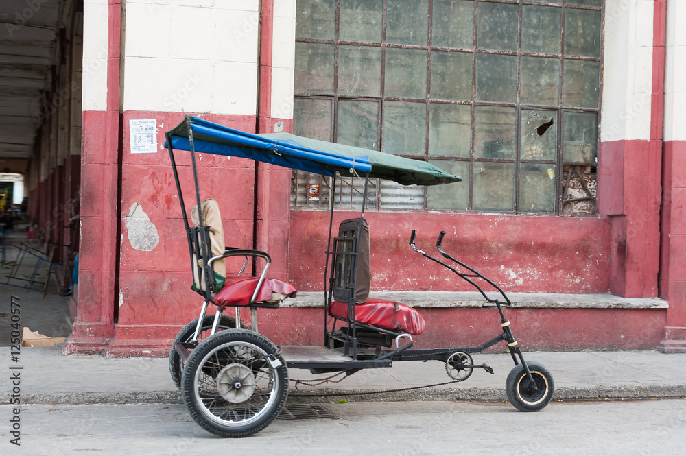 Rickshaw tuk tuk idle in Havana Cuba