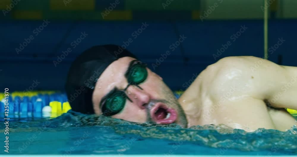 expert swimmer trains at the pool before a race, swimming keeps you fit and is one of the sports in which they train all the muscles of the body.
