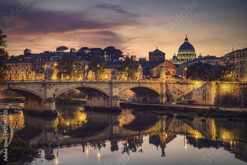 St. Peter's cathedral (Basilica di San Pietro) and bridge (Ponte Vittorio Emanuele II) over river Tiber in the evening after sunrise, Rome, Italy, Europe, Vintage filtered style