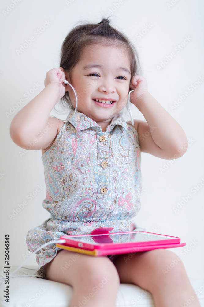 Little Girl playing Tablet Computer
