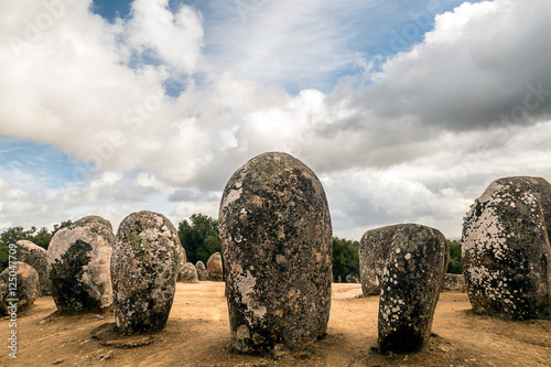 Almendres cromlech. Evora, Portugal. 
It is one of the most important megalithic monuments of the Iberian Peninsula and one of the most important in Europe. photo