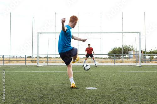 Player kicking a soccer ball