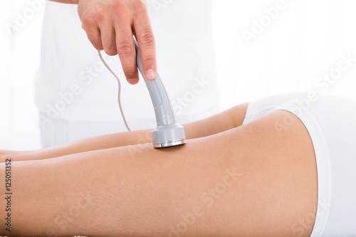 Woman Getting Microdermabrasion Therapy On Her Legs