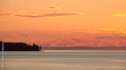 Lake and forest at night, Sweden. Tranquil and peaceful nature scene with beautiful scenic landscape.