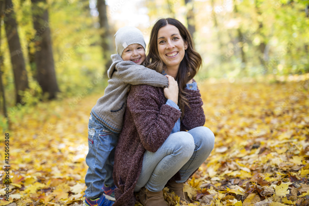 Mother with son in forest in autumn Mother with son in forest in autumn