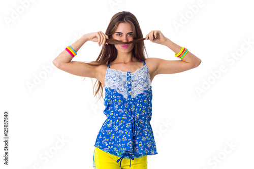 Woman making moustache of her hair 