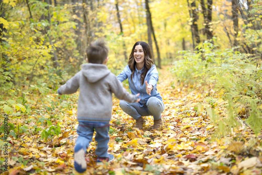 Mother with son in forest in autumn Mother with son in forest in autumn