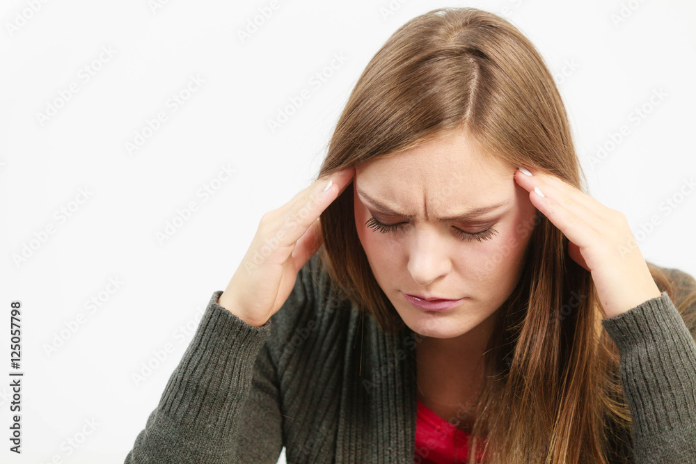 Young woman with painful headache
