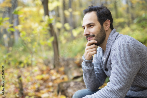 middle-aged man alone on beautiful autumn day photo