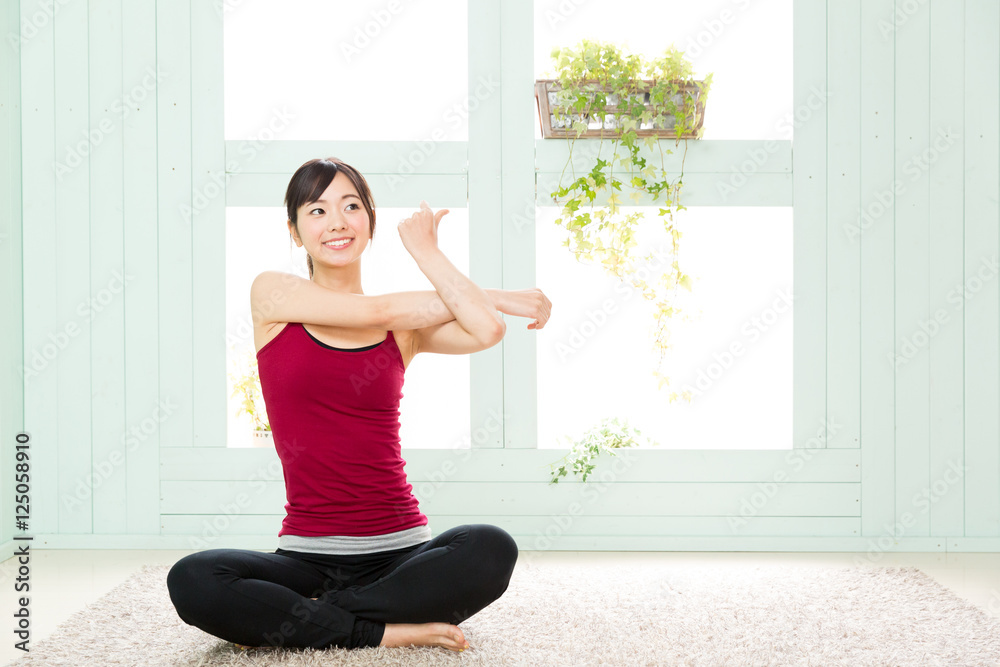 young asian woman exercising in the room