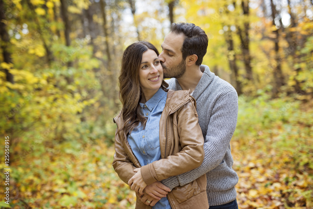 Nice couple having fun in autumn park Nice couple having fun in autumn park