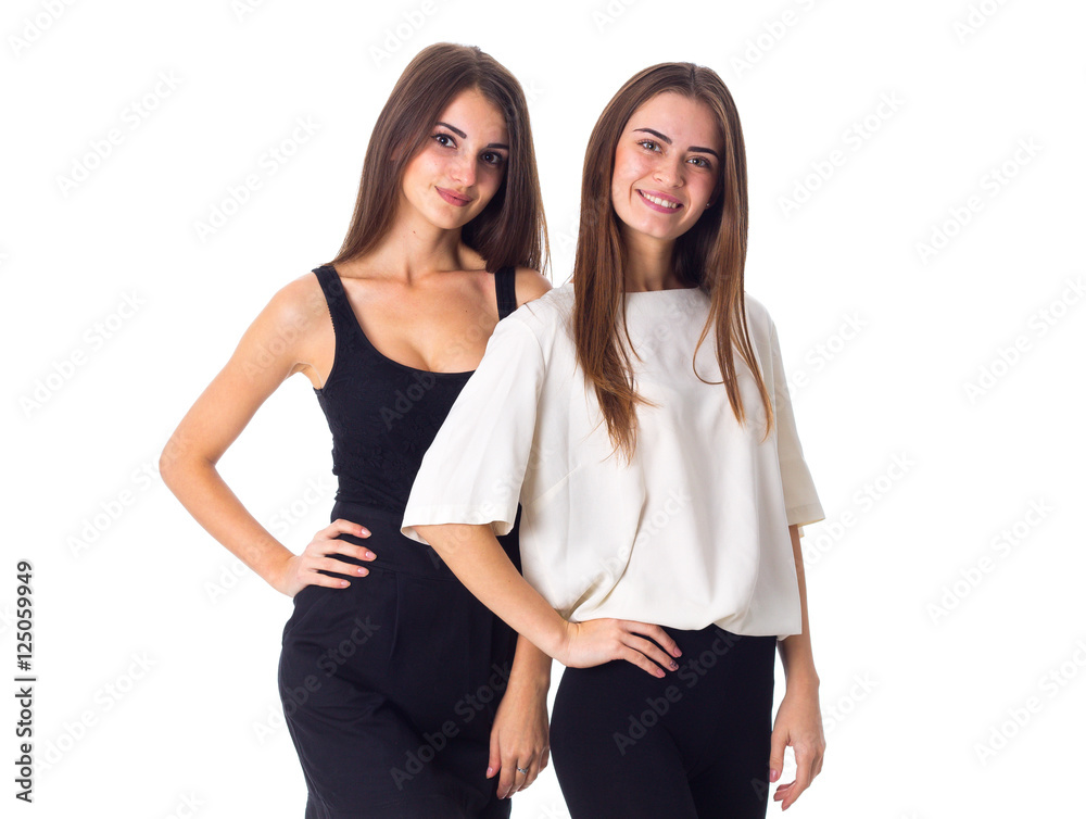 Two young woman standing and smiling Two young woman standing and smiling