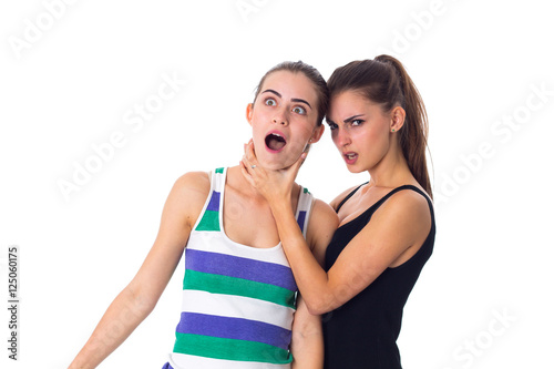Young woman keeping another woman's throat 