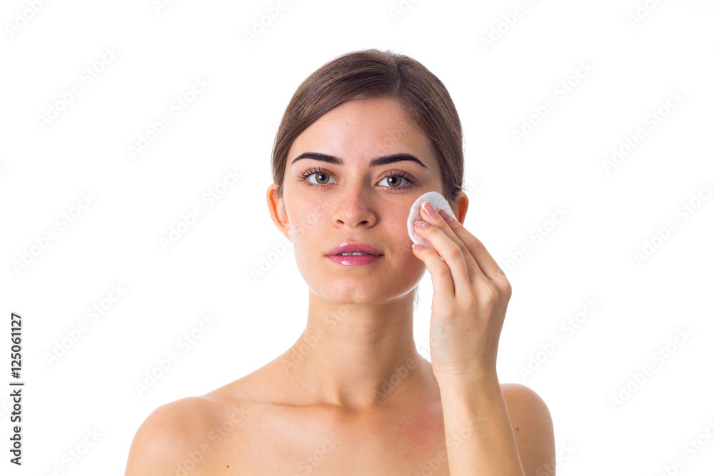 Young woman using cotton pads