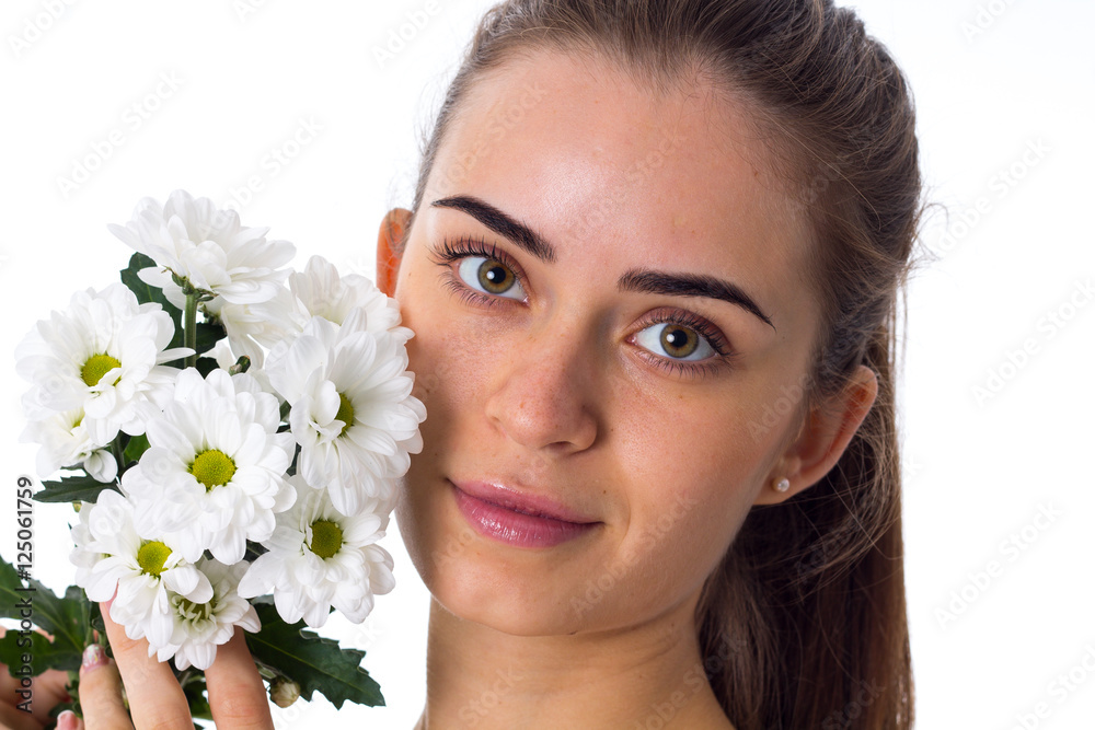 Young woman holding white flowers Young woman holding white flowers