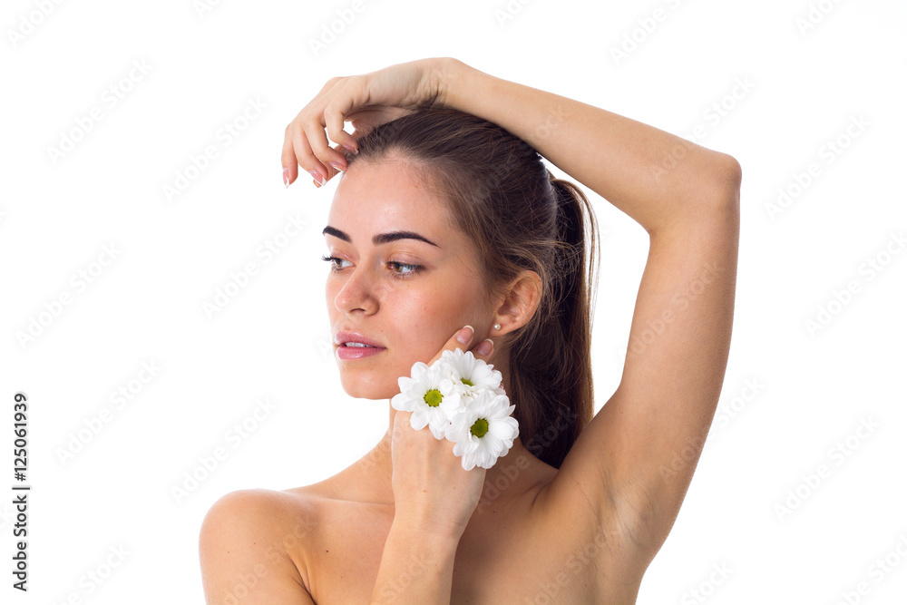 Young woman holding white flowers Young woman holding white flowers