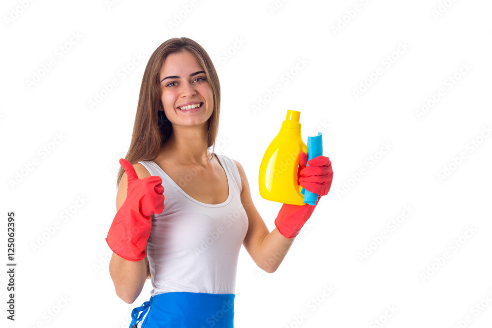 Woman holding duster and detergent Woman holding duster and detergent