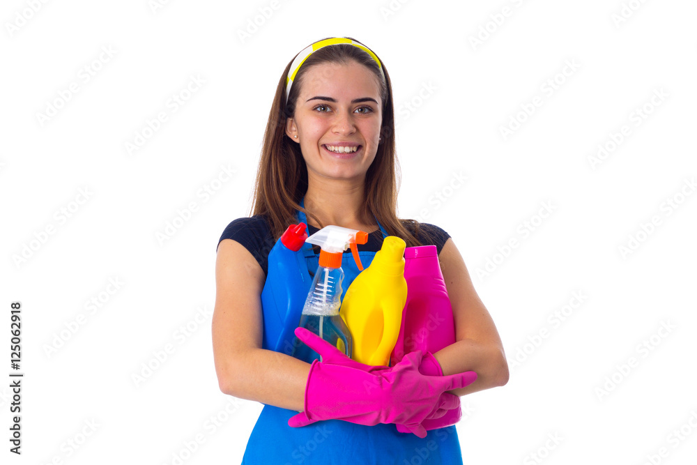 Woman in apron holding a detergents Woman in apron holding a detergents