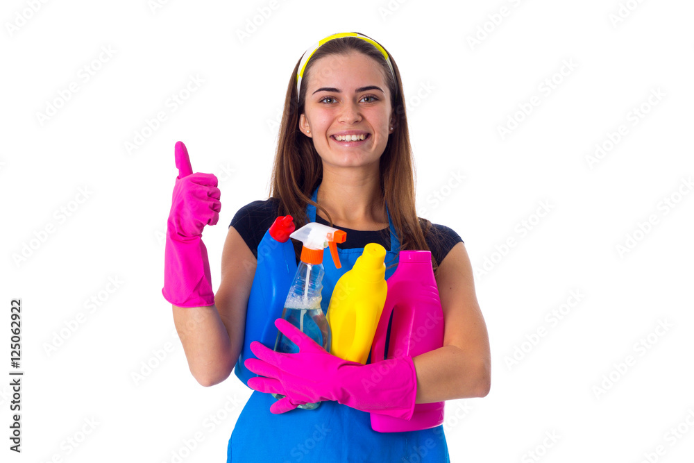 Woman in apron holding a detergents Woman in apron holding a detergents