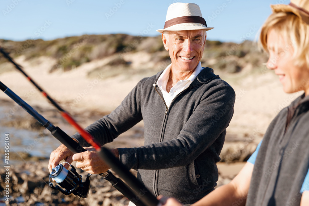 Senior man fishing with his grandson Senior man fishing with his grandson