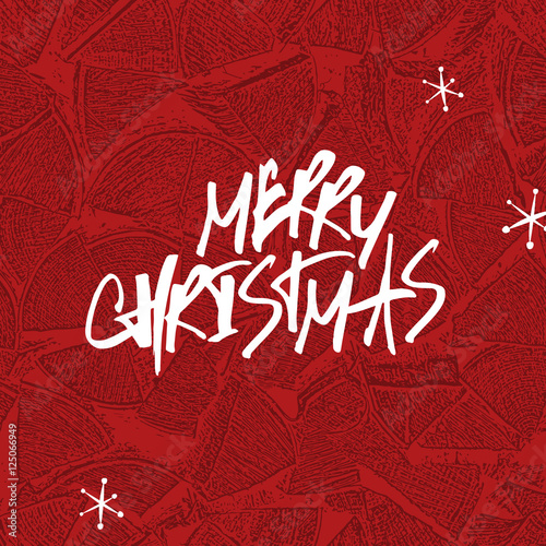 Merry Christmas Lettering. Stack of firewoods background