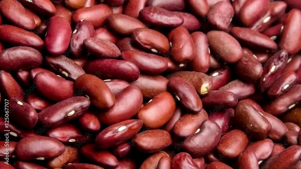 Macro close up of nutritious dried red kidney beans being scooped up with a wooden spoon, 4K 24p Macro close up of nutritious dried red kidney beans being scooped up with a wooden spoon, 4K 24p