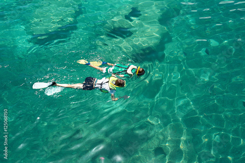 two people snorkeling