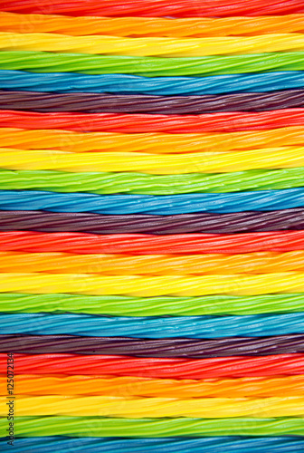 background of colorful twisted licorice candy. rainbow twisted candy. Texture