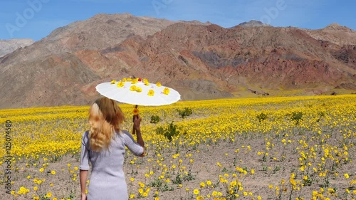 Asian Girl Walking in Field of Flower in Death Valley