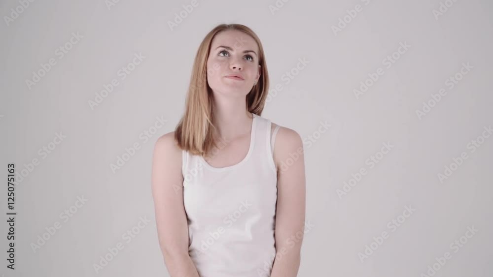 Young woman finding invisible string or web in the air and trying to pull it. Connection concept. Properly color corrected version Young woman finding invisible string or web in the air and trying to pull it. Connection concept. Properly color corrected version