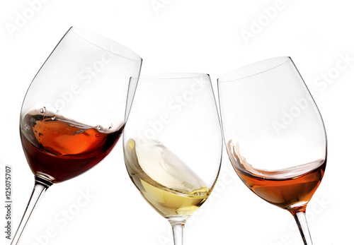 Toasting gesture red and white wine with splash, cheers close up with wine isolated 