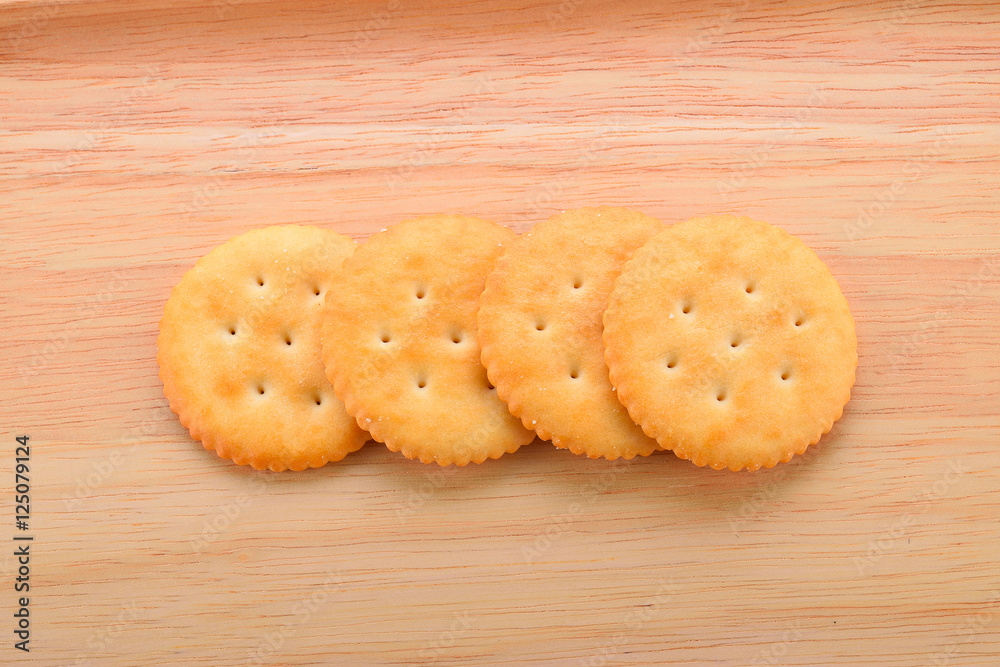 Biscuit isolated on the wooden floor.