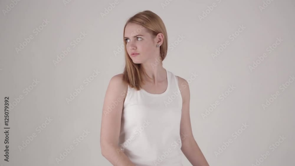 Woman comes into frame, tries to break invisible wall, then turns, breaks the wall and falls out of frame. Concept of oppression, lack of freedom, addiction. No color grading (color corrected version Woman comes into frame, tries to break invisible wall, then turns, breaks the wall and falls out of frame. Concept of oppression, lack of freedom, addiction. No color grading (color corrected version