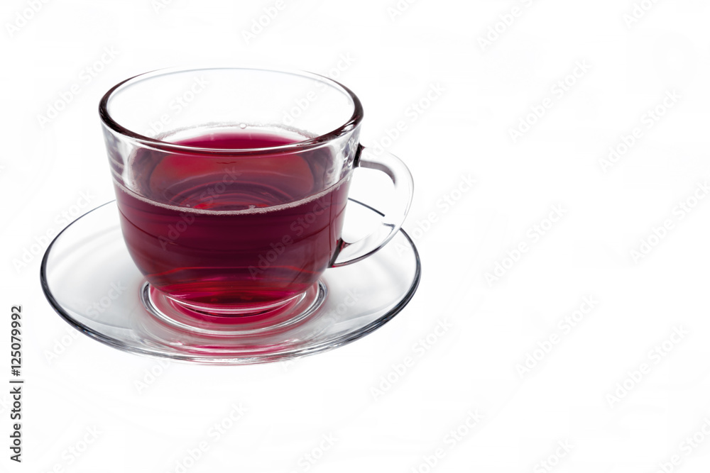 transparent glass cup with Hibiscus tea on a saucer isolated transparent glass cup with Hibiscus tea on a saucer isolated