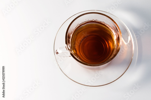 transparent glass cup with tea on