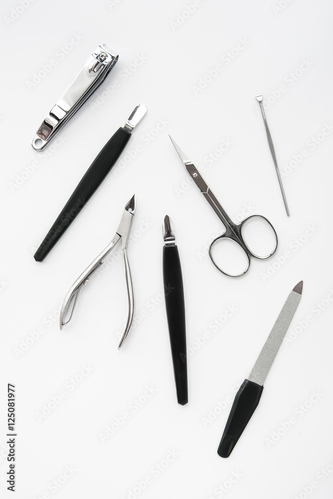 manicure instruments set on white background top view