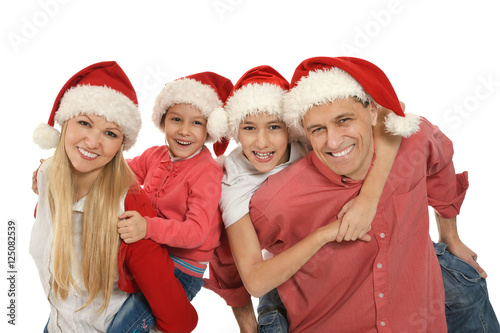 family with kids   in santa hats