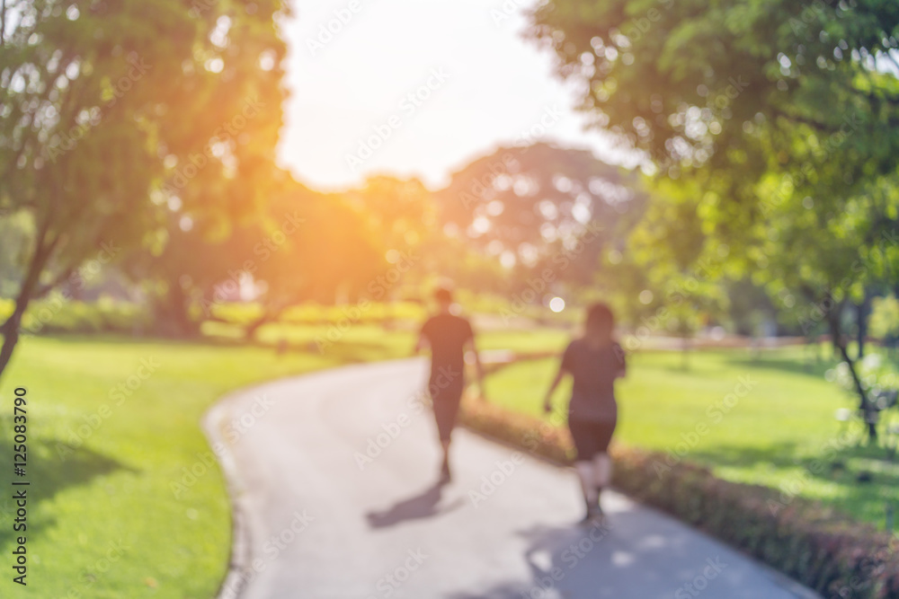 Fototapeta premium Blurry focus scene of people in public park