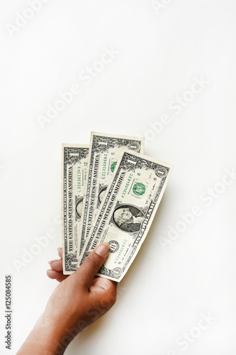 One dollars bill on hand isolated on white background