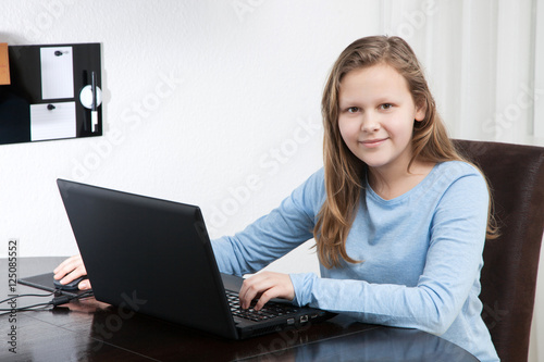 portrait young pretty girl using the laptop