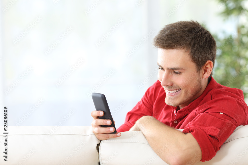 Man watching media content in a phone Man watching media content in a phone