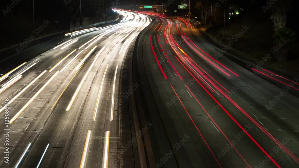 Zoom Out - Time Lapse of Night Traffic of Freeway in Downtown Los Angeles.