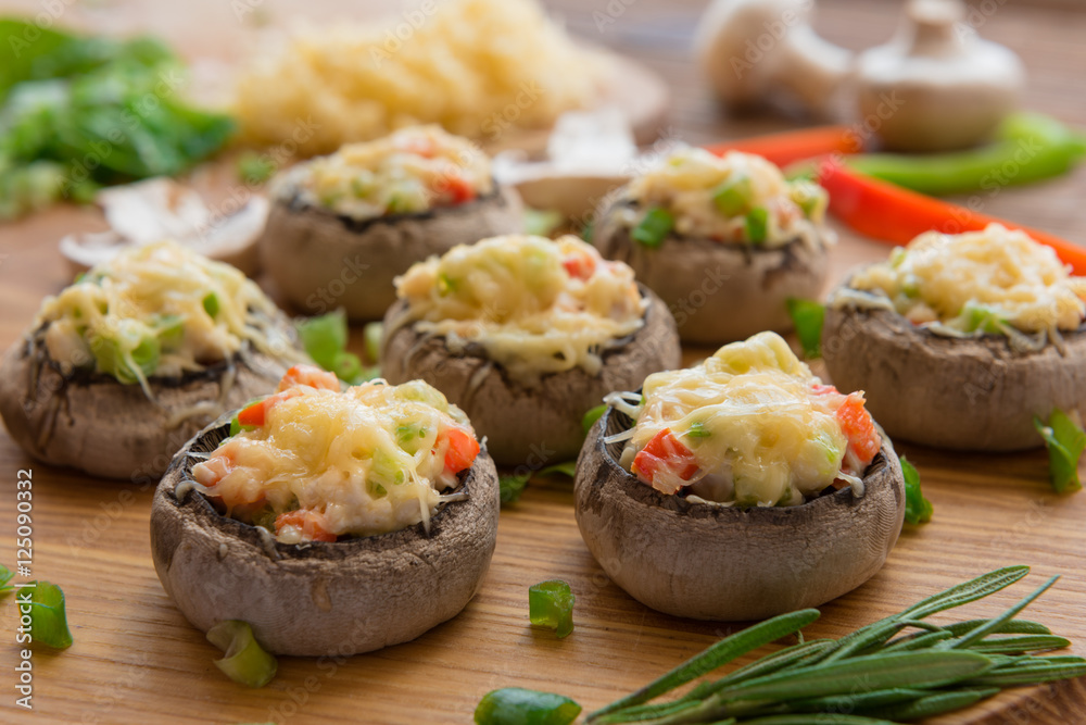 Baked mushrooms with white sauce and vegetables Baked mushrooms with white sauce and vegetables