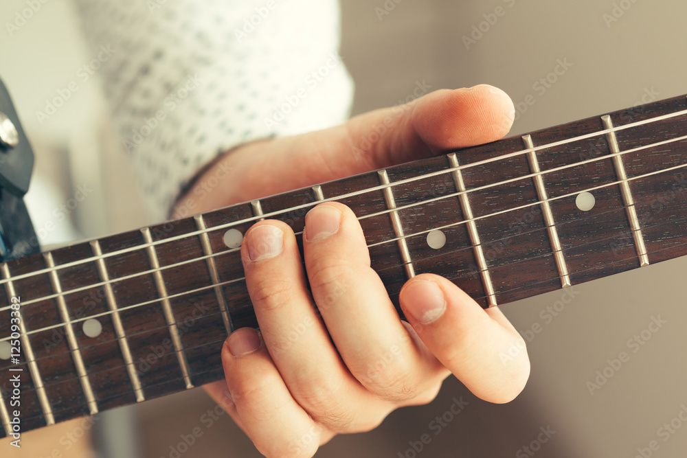 man playing electric guitar man playing electric guitar