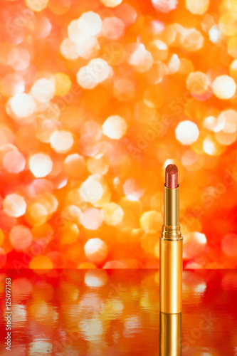Red lipstick on red blurred...